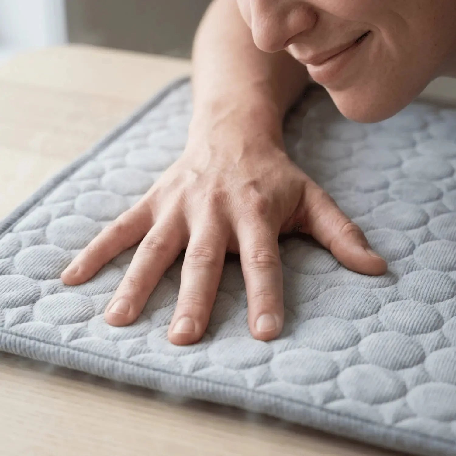 Hand showing the soft texture of a CoolPaws cooling mat